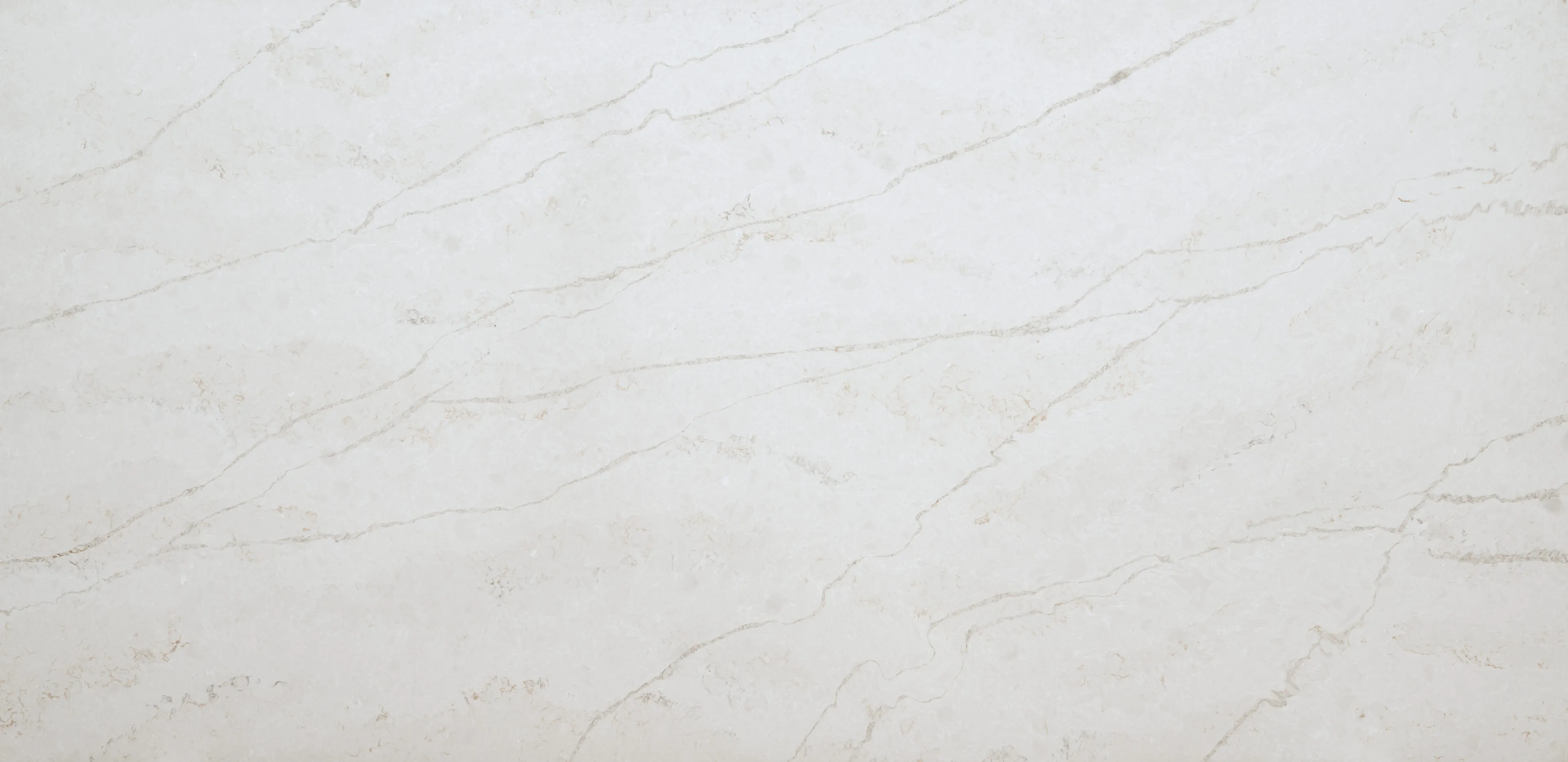 The Elara quartz slab embodies a harmonious fusion of celestial beauty in soft whites and silvery grey veins. Resembling the natural veining found in marble, these formations are distinct and a perfect compliment to several installation applications.